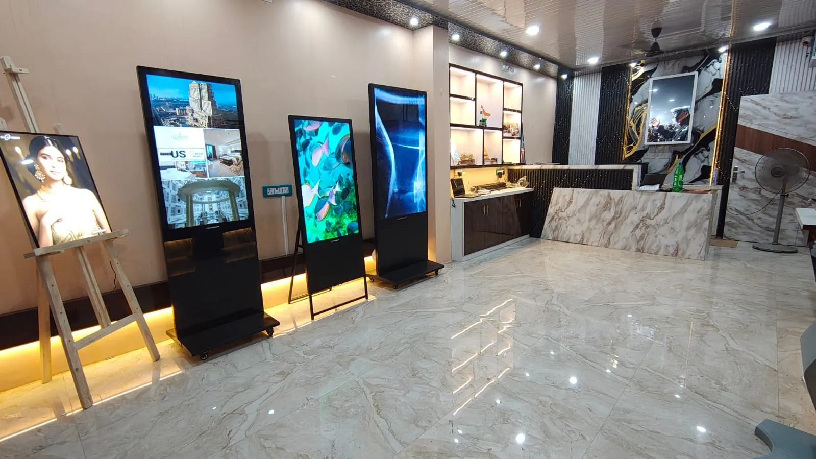 Capital Infoart experience centre, easel and floor-standing displays beside the reception