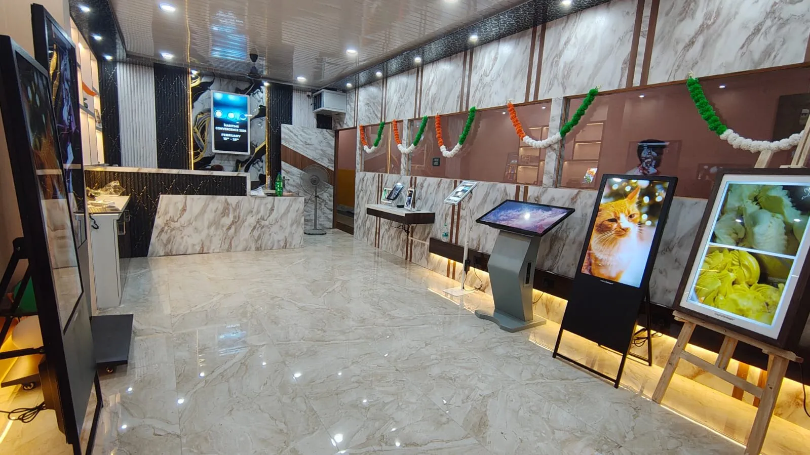 Capital Infoart experience centre, touch kiosk, easel displays and wall-mounted glass signage