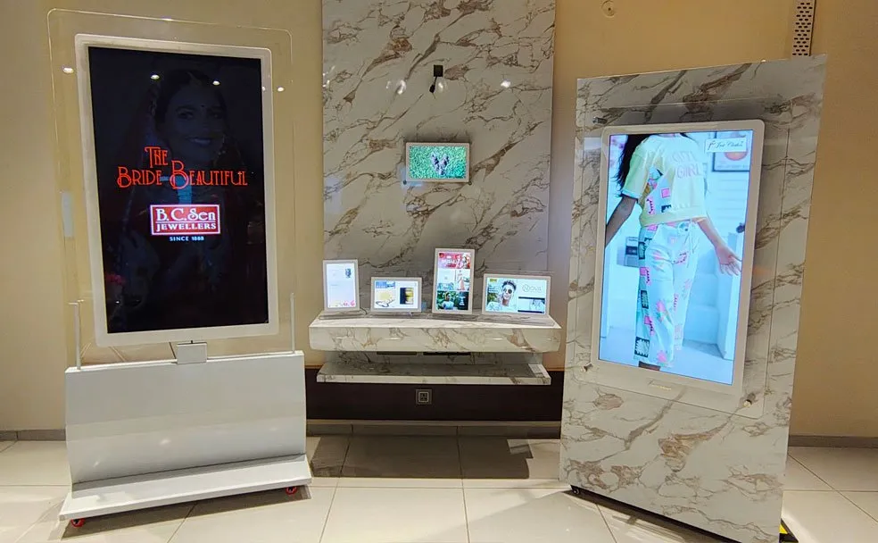 Two easel-mounted Premium Glass Signage units in a jewellery showroom