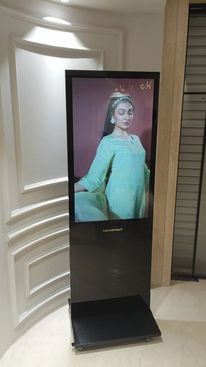 T-Type kiosk showing a fashion advertisement in a hotel corridor