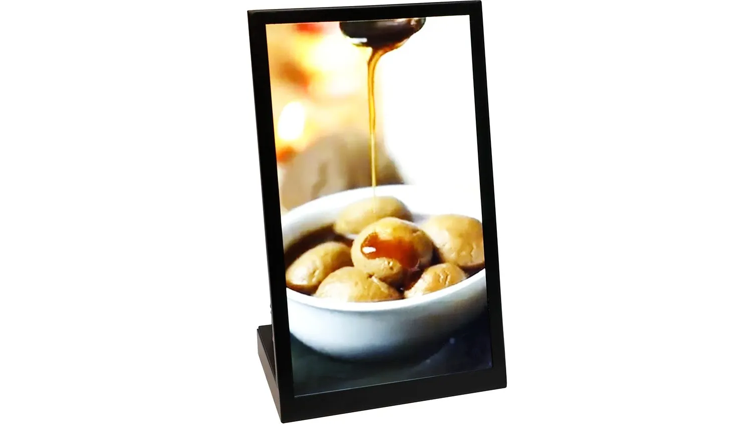 Capital Infoart glass table-top digital display on a black stand showing a food advert