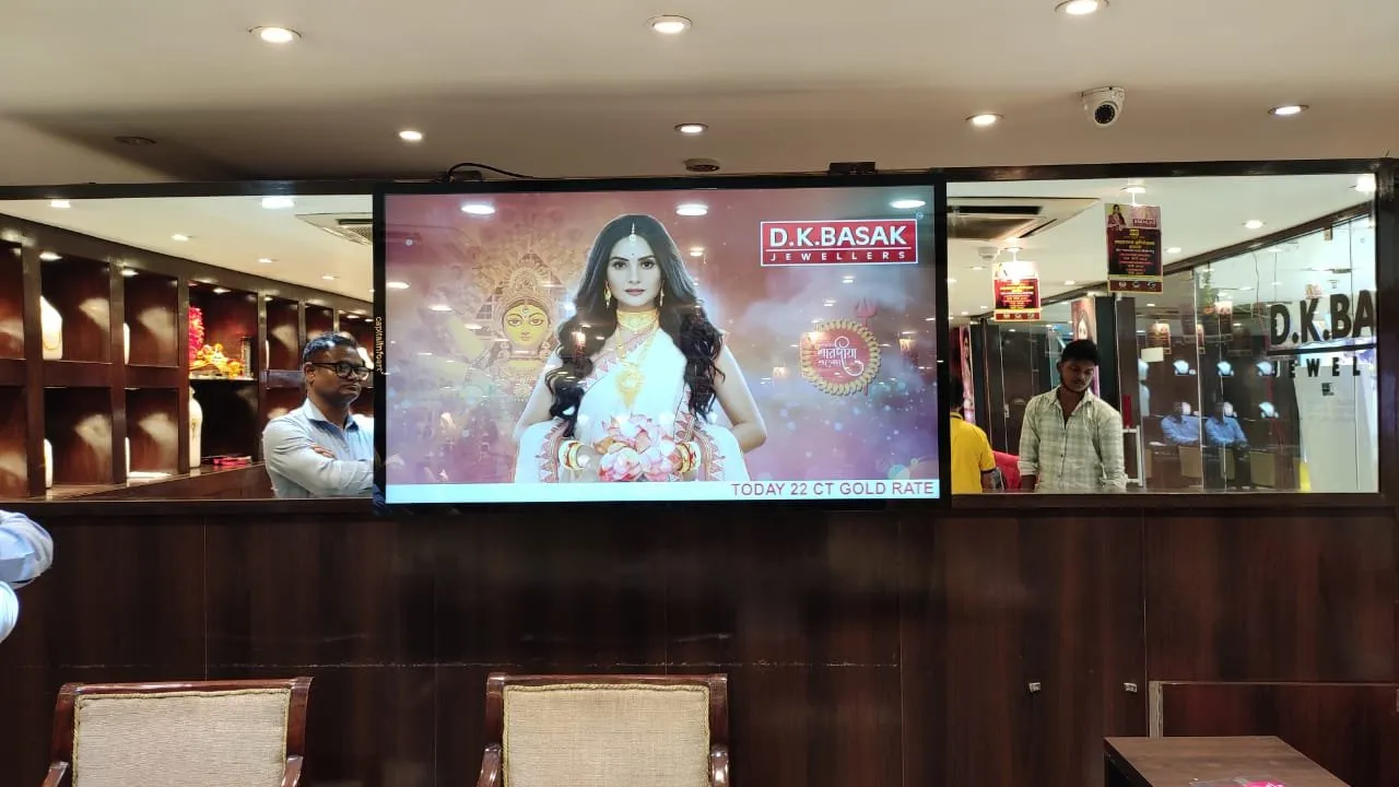 55 inch metal wall mount display above a jewellery store counter